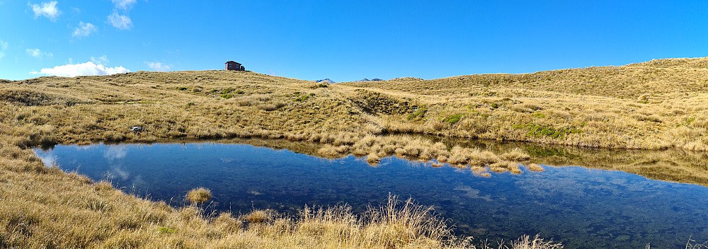 Mataketake hut over tarn
Photographer;&nbsp;Simon
2023-04-19&nbsp;11.43.58;&nbsp;Metadata time: '2023 Apr 19 11:43'
Original size:&nbsp;16,373 x 5,766; 98,314 kB;&nbsp;stitch
Filename: 2023-04-19 11.43.58 S20+ Simon - Mataketake hut over tarn_stitch.jpg